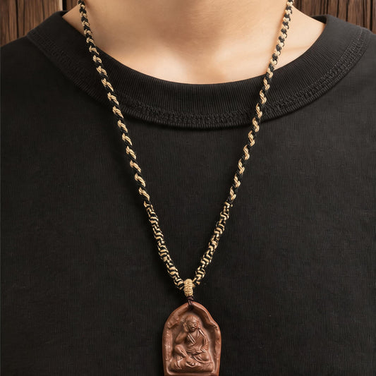 Model wearing Milarepa sage tsatsa pendant necklace