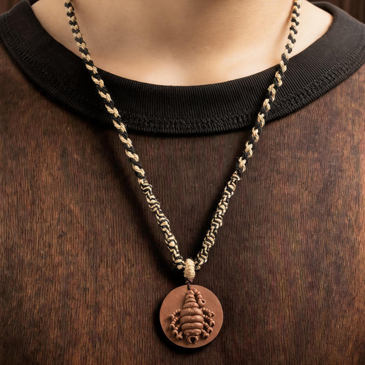 Model wearing scorpion tsatsa pendant necklace