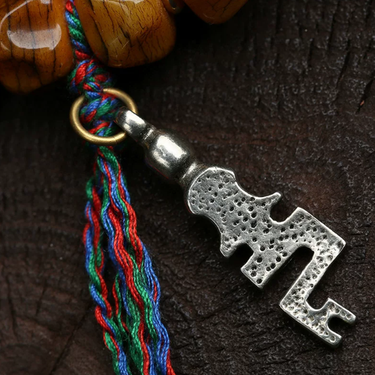 Carved yak bone Tai Chi bead bracelet close up
