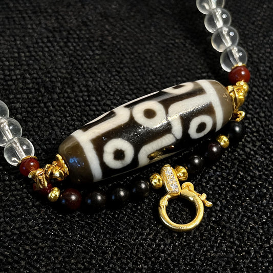 Design Q dzi bead pendant detail close-up