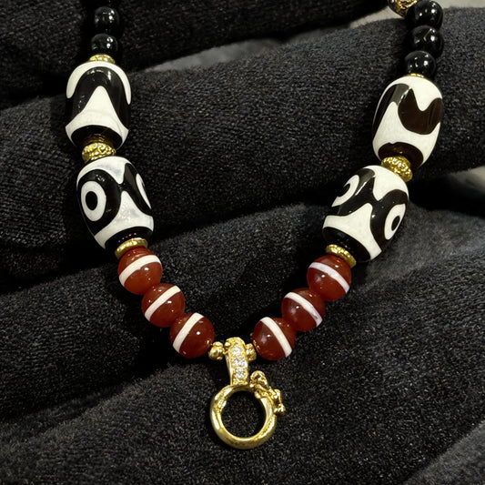 Design P dzi bead pendant detail close-up