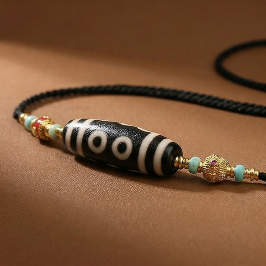 Five eye dzi bead necklace side view