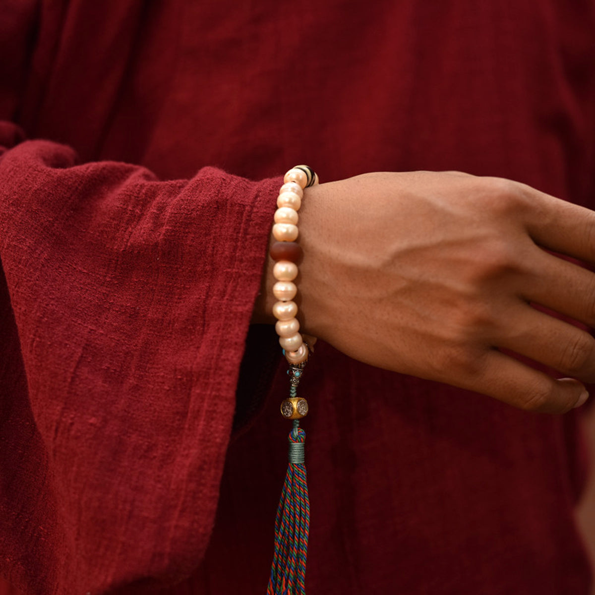 Handcrafted Champagne Pearl Bracelet with Tassel - wearing