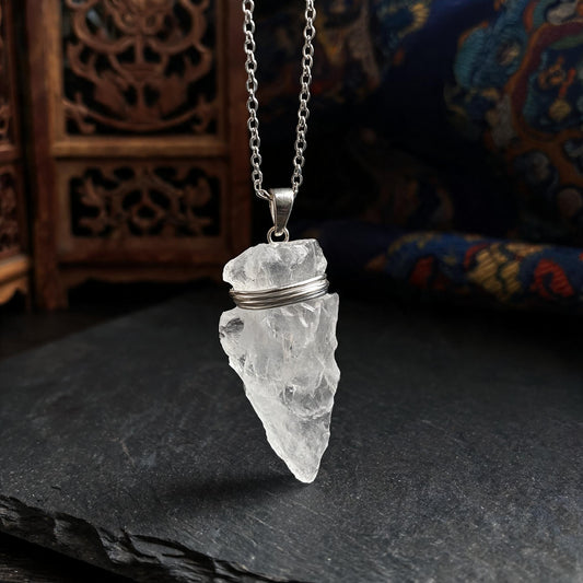 Clear quartz arrowhead pendant necklace with silver chain three quarter view