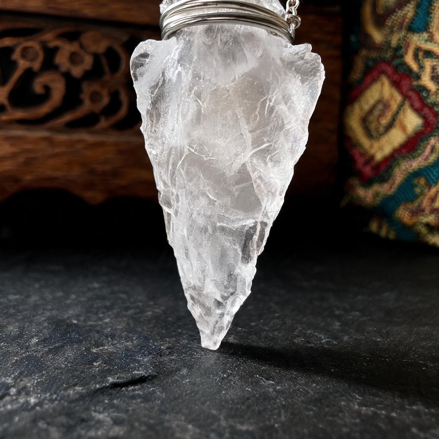 Clear quartz arrowhead pendant necklace with silver chain crystal tip detail