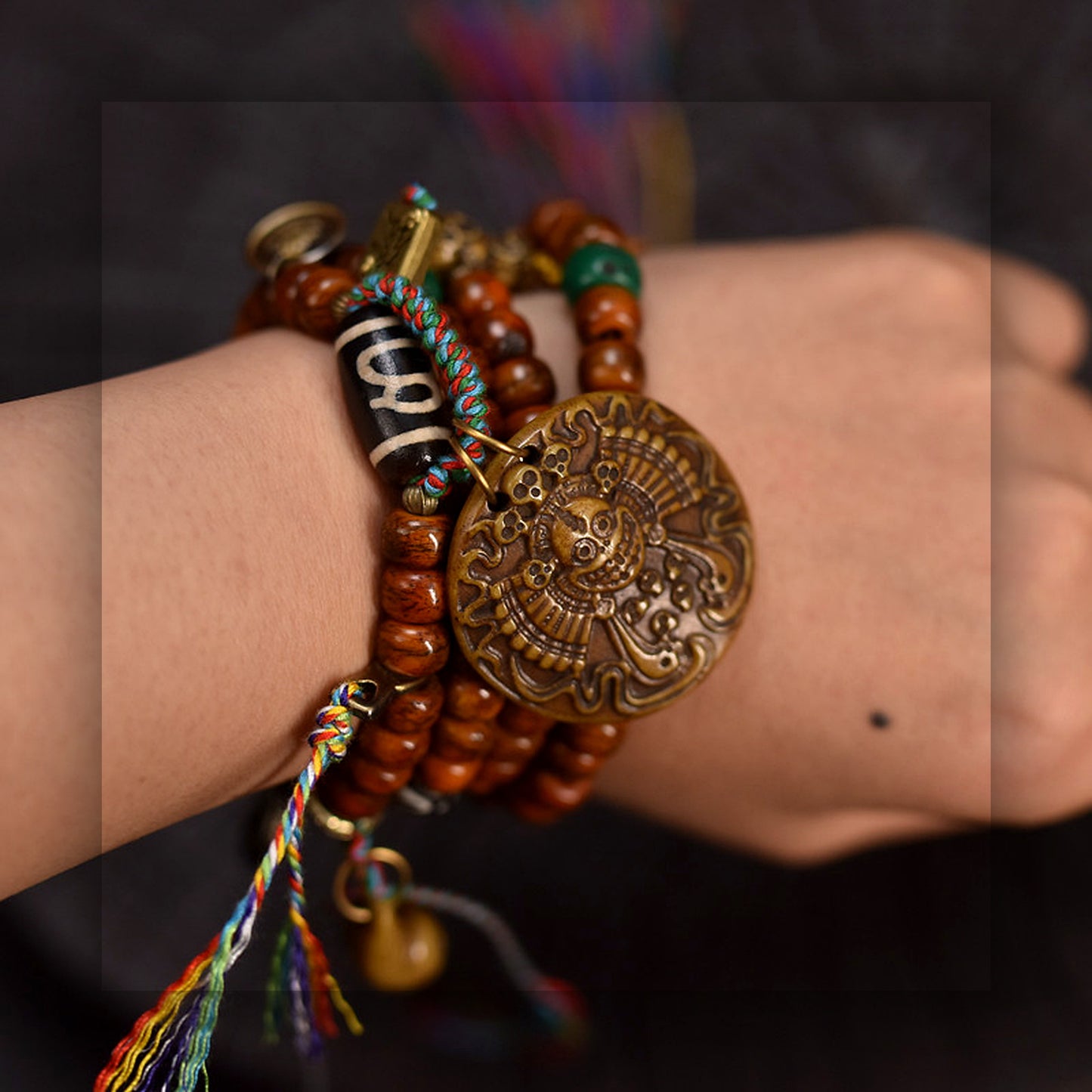 Collector grade Tibetan yak bone 108 mala with Dzi bead wrist wearing view