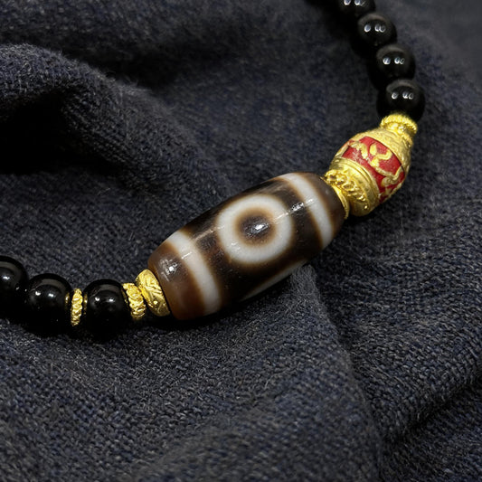 Design J dzi bead pendant detail close-up