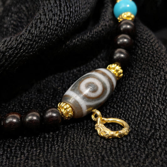 Design E dzi bead pendant detail close-up