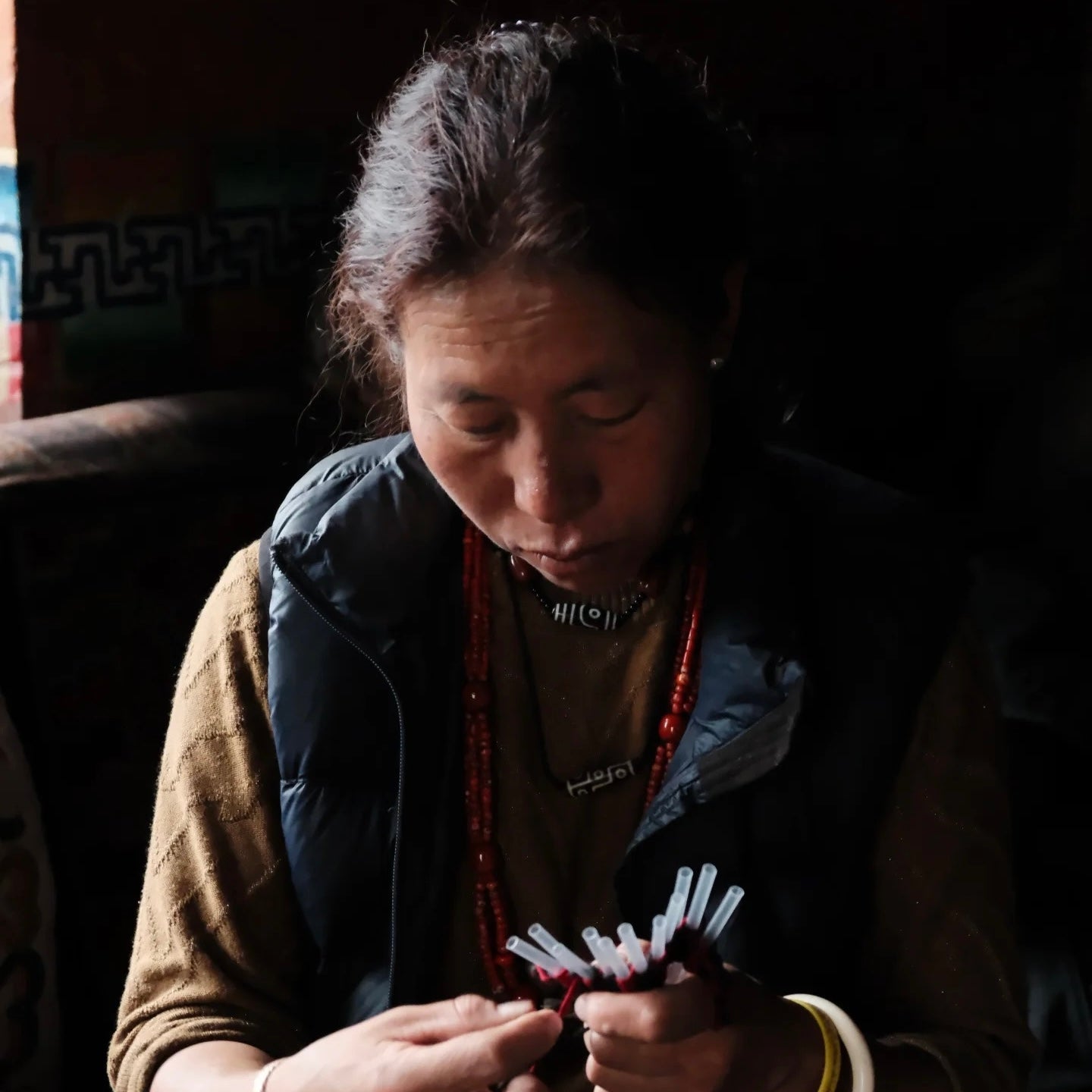 Artisan working with cord by hand