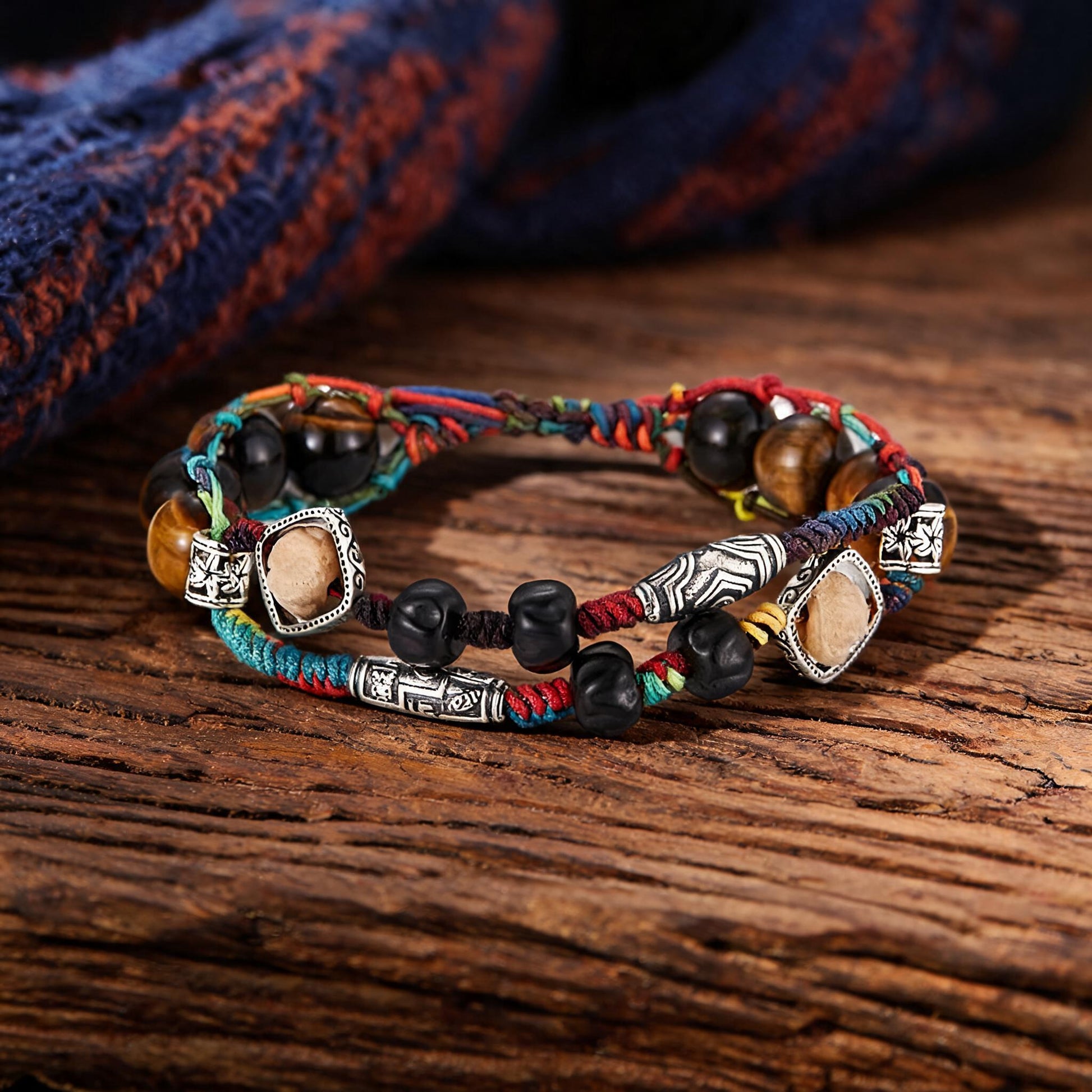 Hand-woven multicolor cord bracelet with tiger's-eye-toned beads, front view