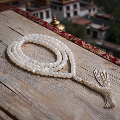 Handcrafted Mother-of-Pearl 108 & 27-Bead Mala Collection - Tibetan Spirit · 7×6 mm · 108 Beads · White-Gold Tassel - three-quarter view