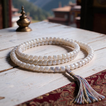 Handcrafted Mother-of-Pearl 108 & 27-Bead Mala Collection - Light of the Snowlands · 8×7 mm · 108 Beads · Multicolor-Gold Tassel - three-quarter view