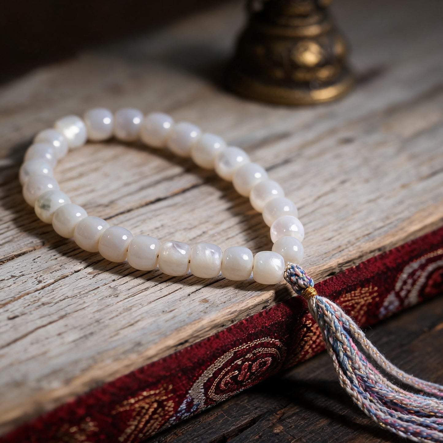 Handcrafted Mother-of-Pearl 108 & 27-Bead Mala Collection - Travel Hand Mala · 8×7 mm · 27 Beads · Multicolor-Gold Tassel - low side view