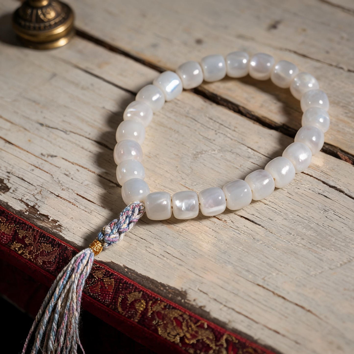 Handcrafted Mother-of-Pearl 108 & 27-Bead Mala Collection - Travel Hand Mala · 8×7 mm · 27 Beads · Multicolor-Gold Tassel - material and construction detail