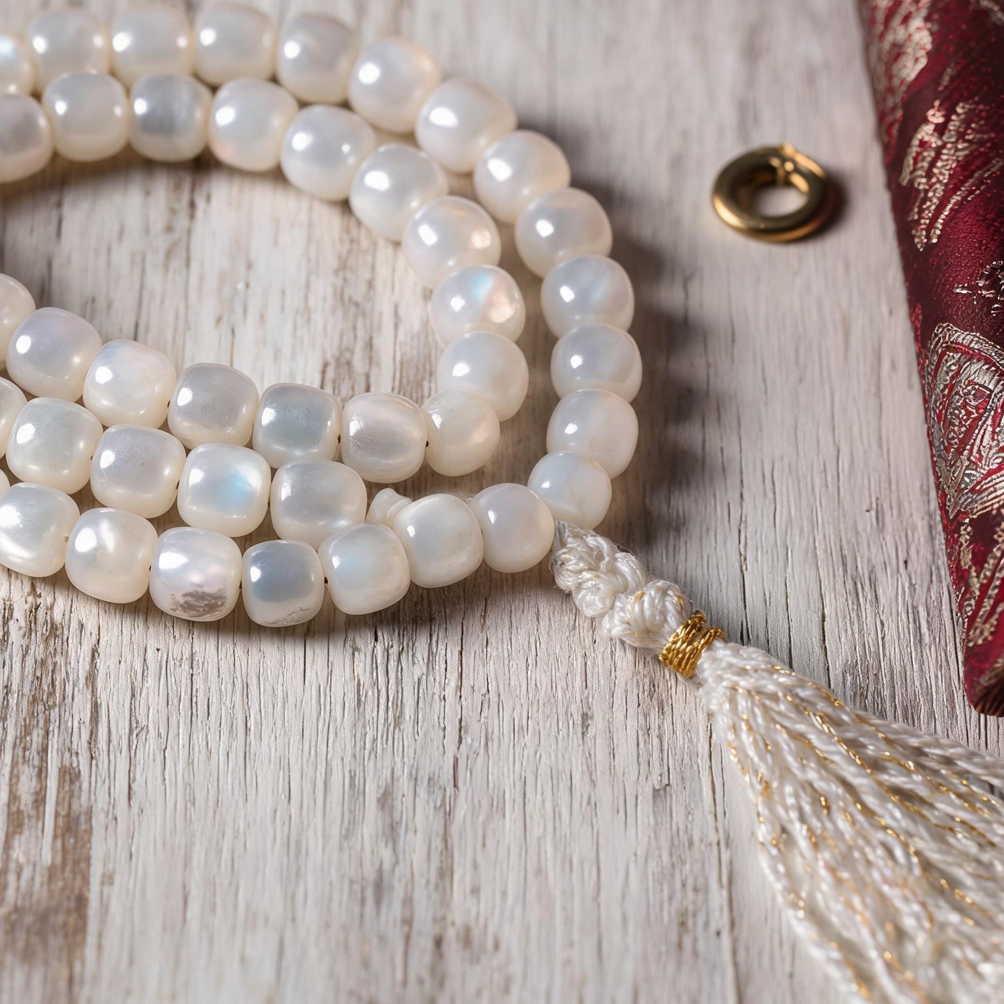Handcrafted Mother-of-Pearl 108 & 27-Bead Mala Collection - Tibetan Spirit · 7×6 mm · 108 Beads · White-Gold Tassel - material and construction detail