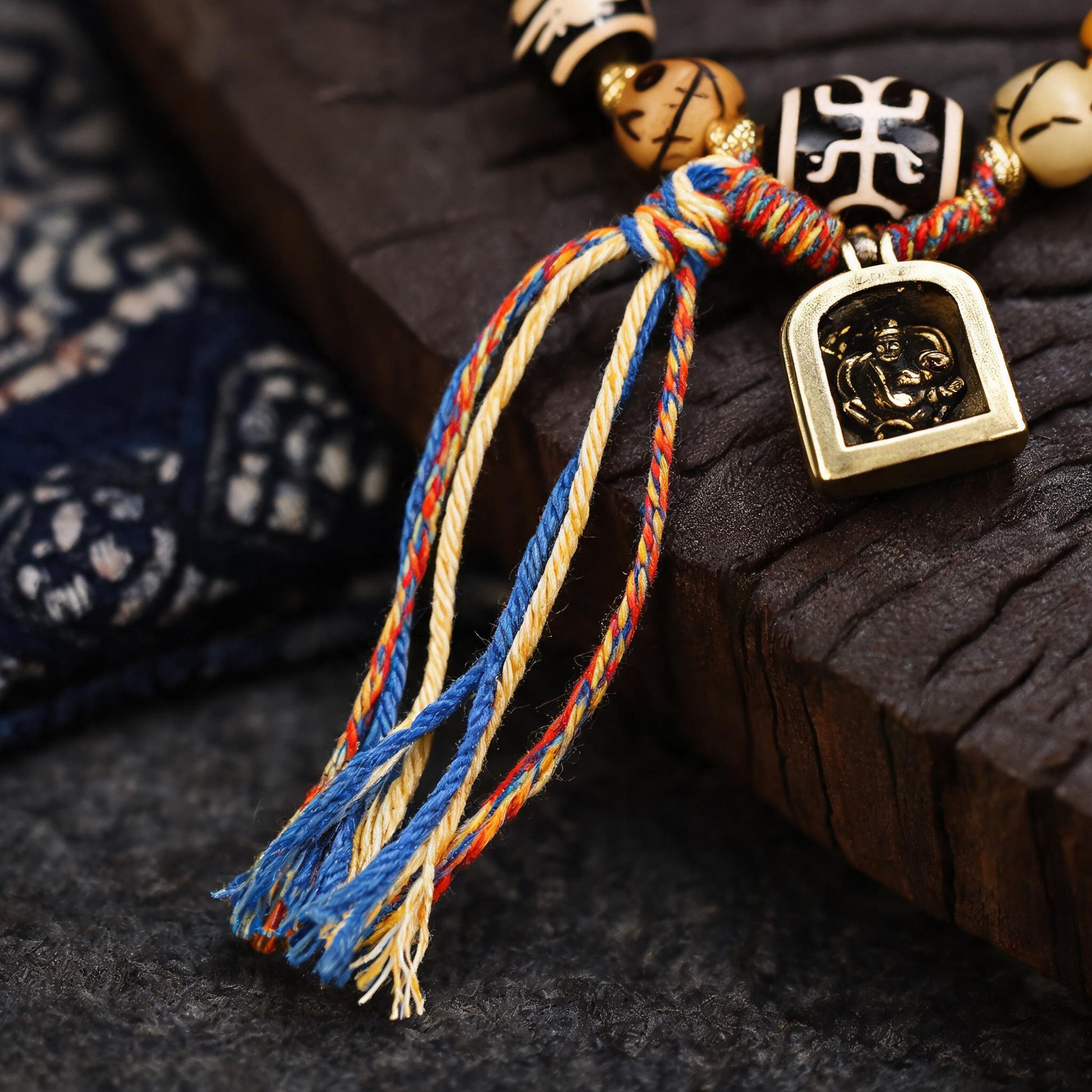 Tibetan bracelet hand-braided tassel and cord knot detail