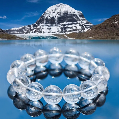 Clear quartz bracelet beside a mountain lake and Mount Kailash