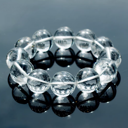 Clear quartz bracelet shown in a close reflected product view