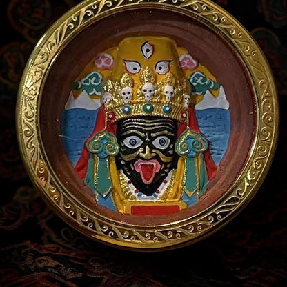 Zaki Lhamo medicine clay pendant face close up