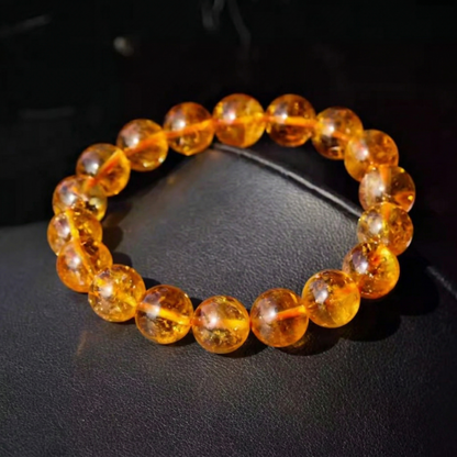 Natural citrine bead bracelet on a dark display surface
