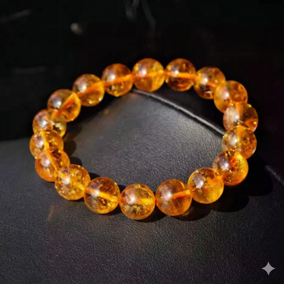 Golden citrine bracelet photographed on a black background