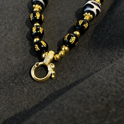 Design G dzi bead pendant detail close-up