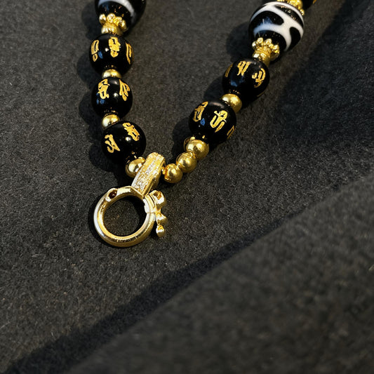 Design G dzi bead pendant detail close-up