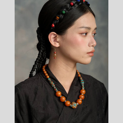 Potala Karma beeswax style necklace close up