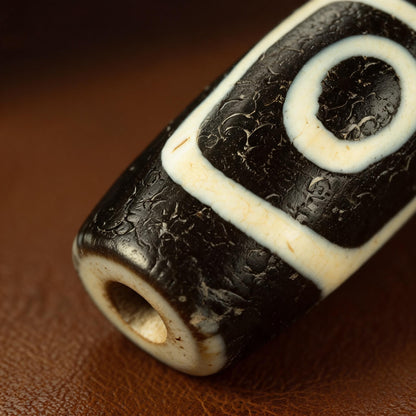 Millennium pure black and white four-eye Dzi bead collector documentation view 4