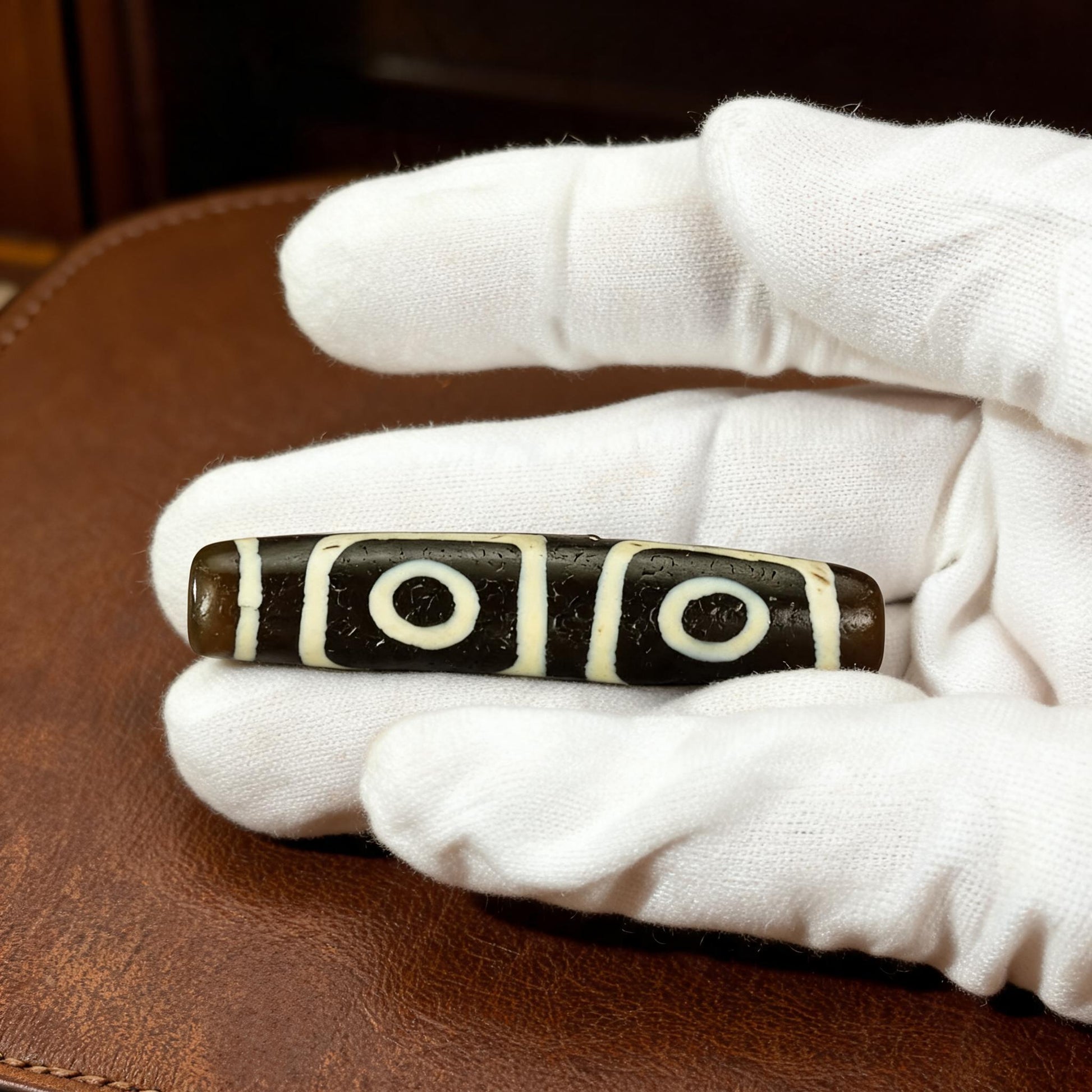 Millennium pure black and white four-eye Dzi bead collector documentation view 5