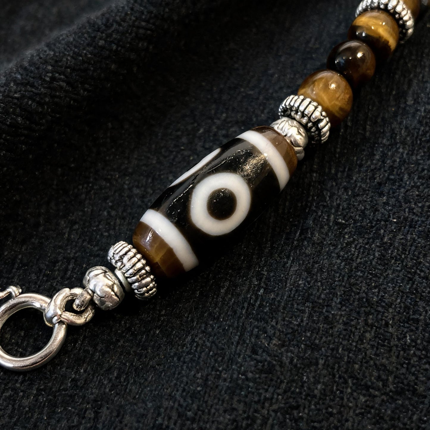 Design A dzi bead pendant detail close-up