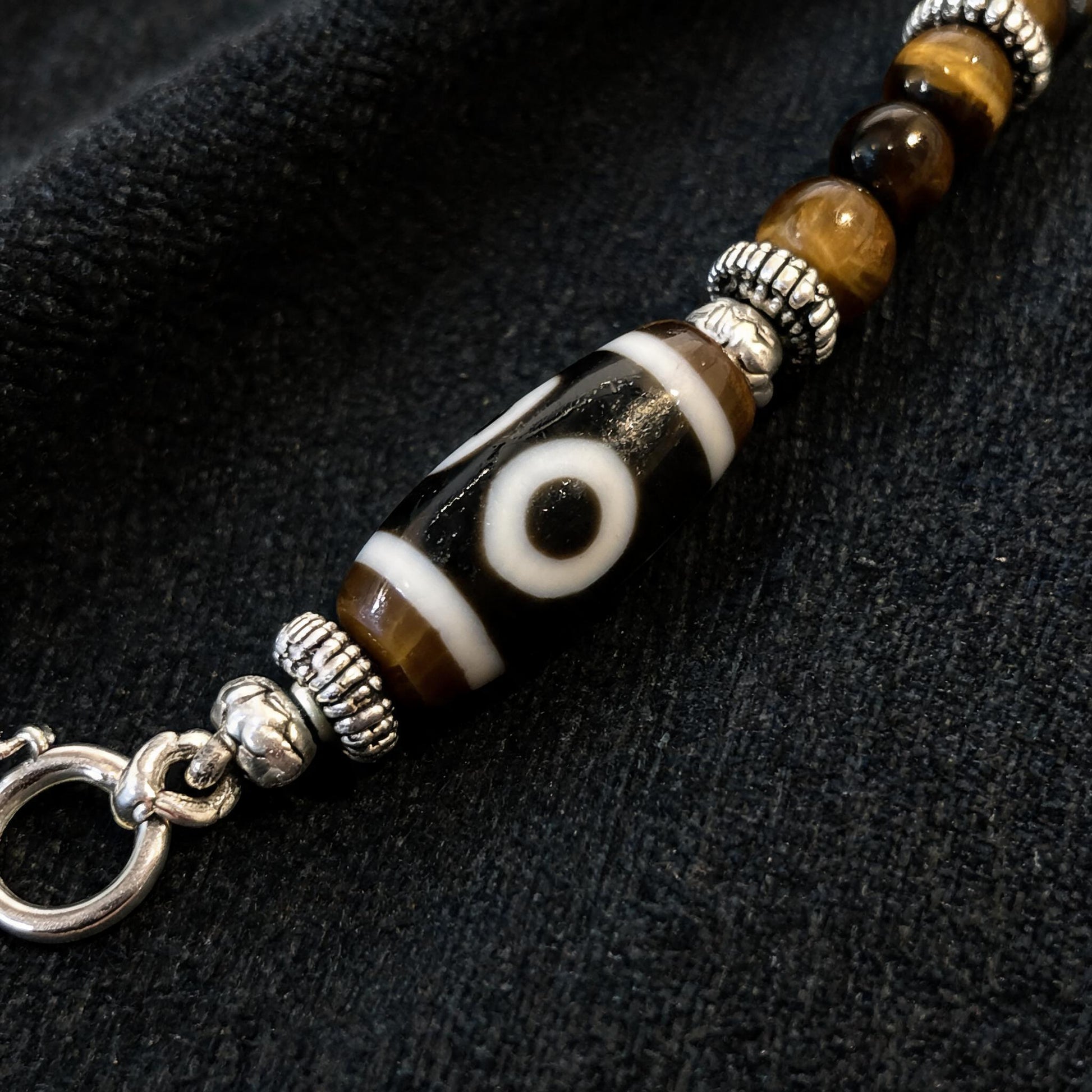 Design A dzi bead pendant detail close-up