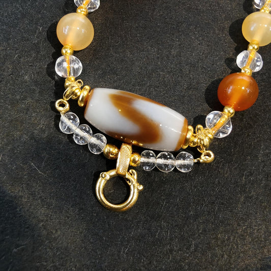 Design T dzi bead pendant detail close-up