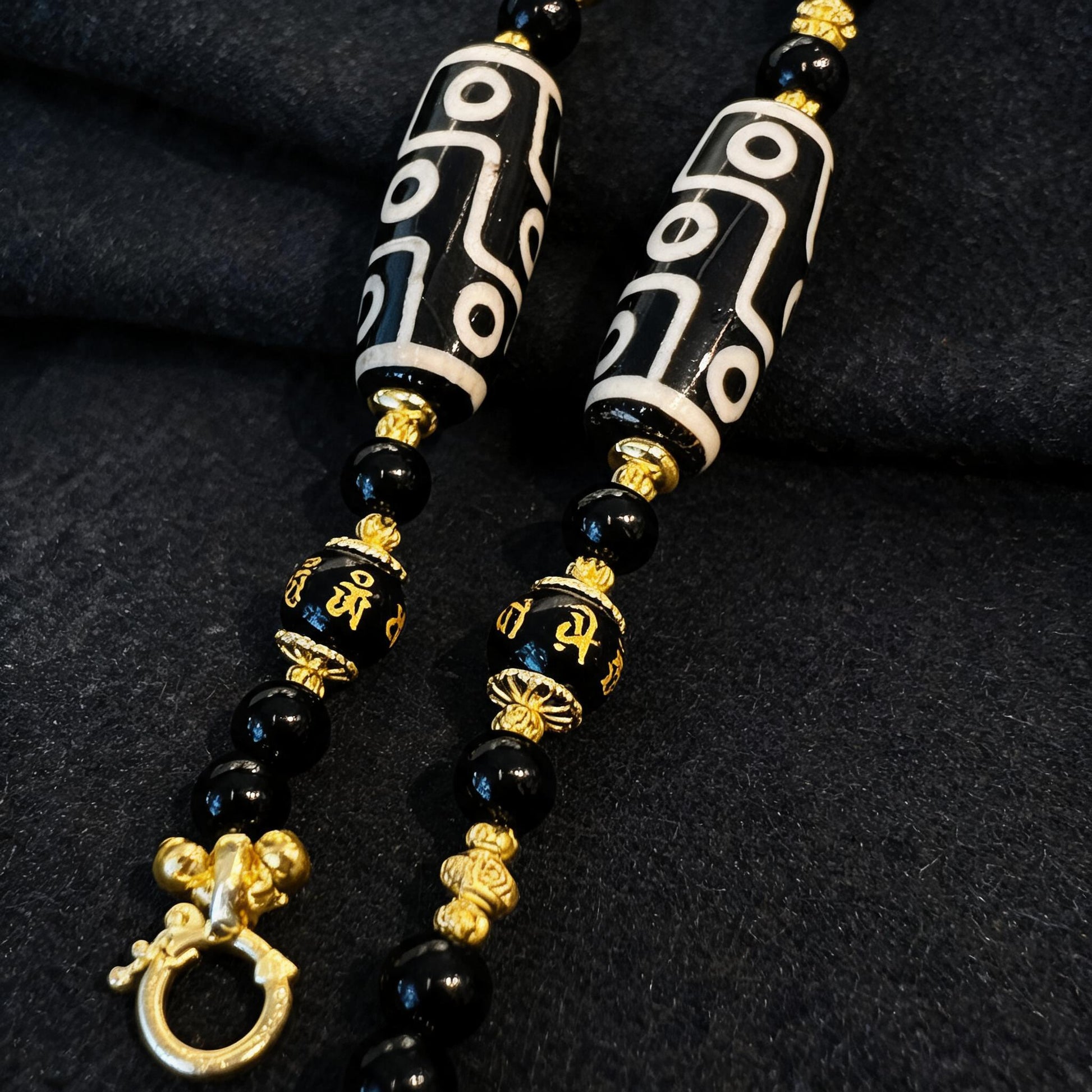 Design R dzi bead pendant detail close-up