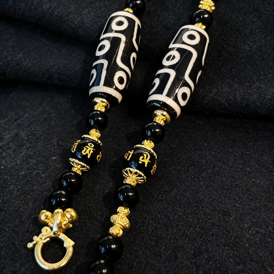 Design R dzi bead pendant detail close-up