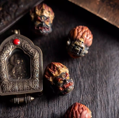 Mahakala bracelet with carved bone beads and metal pendant