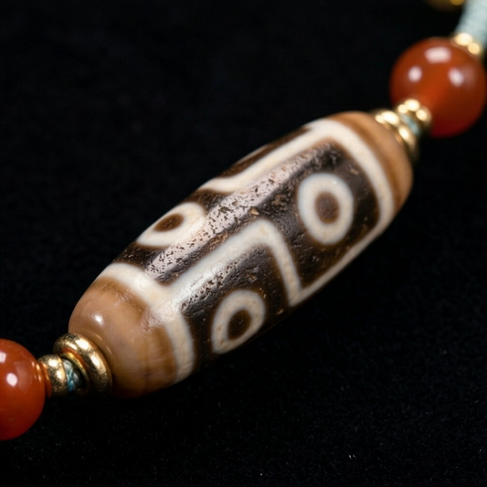 Six eye and tiger tooth dzi necklace side view
