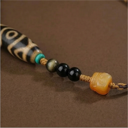 Three eye dzi bead necklace side view