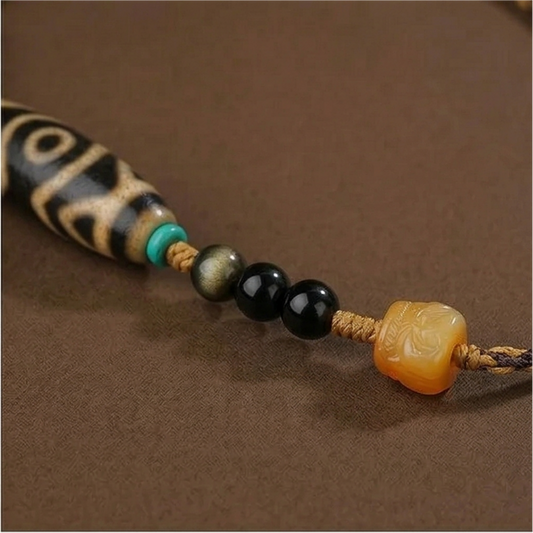 Three eye dzi bead necklace side view