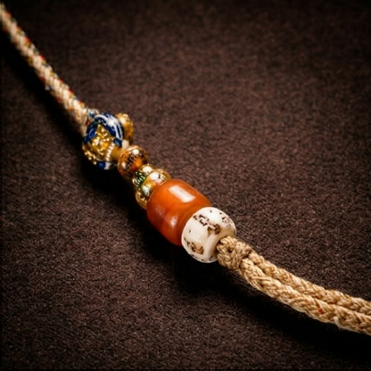 Ox bone and copper pendant detail