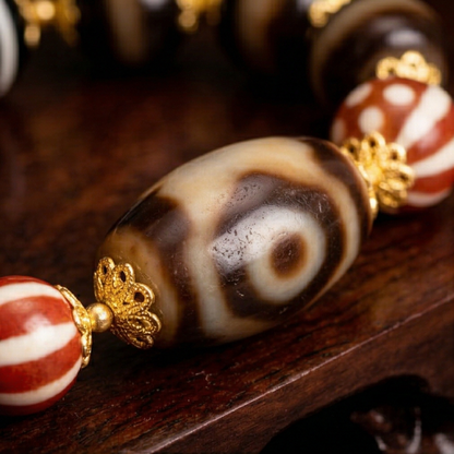 Tiger tooth dzi bead bracelet close up