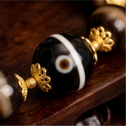 Braided dzi bead bracelet detail