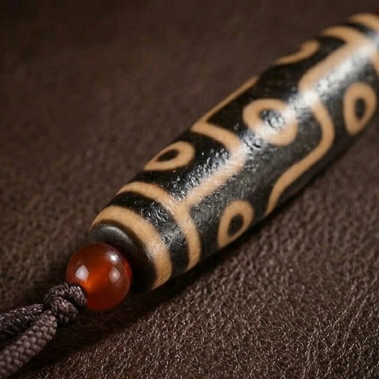 Nine eye and tiger tooth dzi necklace side view