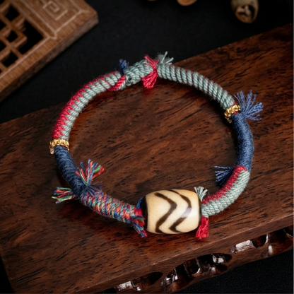 Handmade tiger tooth dzi bead braided bracelet main view