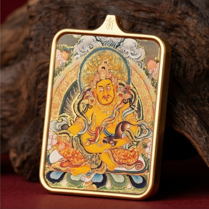 Yellow Jambhala thangka pendant detail