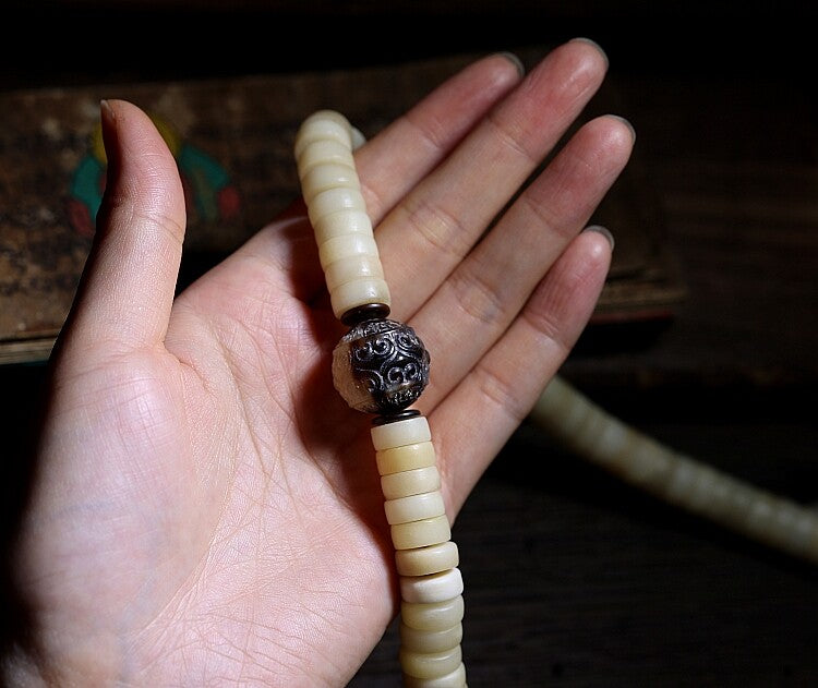 Tibetan yak bone mala bead close up