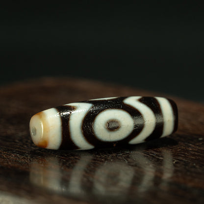 Pure dzi bead three eye motif close up