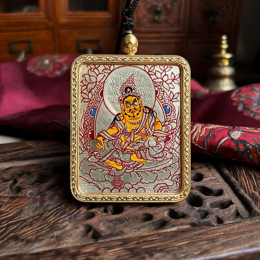 Yellow Jambhala hand-painted Thangka pendant front hero view