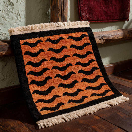Orange Black Wave Mini Tibetan Rug three-quarter view