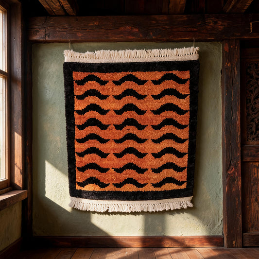 Orange Black Wave Border Mini Tibetan Rug three-quarter view